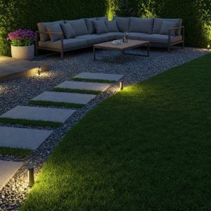 Trabajo de jardín con cesped artificial y grava con sofá exterior y formas geométricas con Elefeme