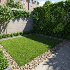 Trabajo de jardín con cesped artificial y grava con parte de jardín vertical para más profundidad con elefeme