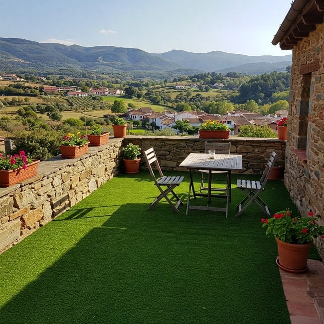 Terraza con césped artificial en Arganda del Rey de Elefeme en casa rústica